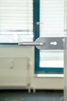 Photo: glass door with a lock symbolising access management