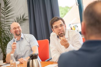 Photo: Employees talking to clients